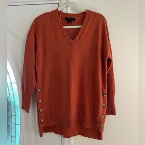 Orange rust Tahari sweater with button details